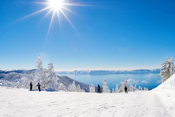 Skiers at Diamond Peak Ski Resort overlooking Lake Tahoe