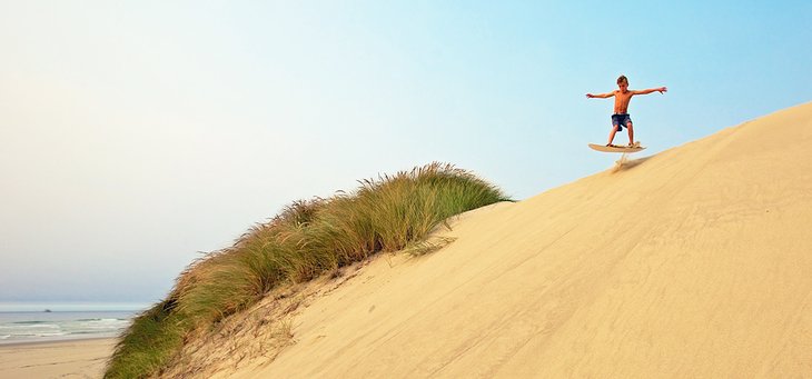 Sandboarding at Oregon Dunes National Recreation Area near Florence, Oregon