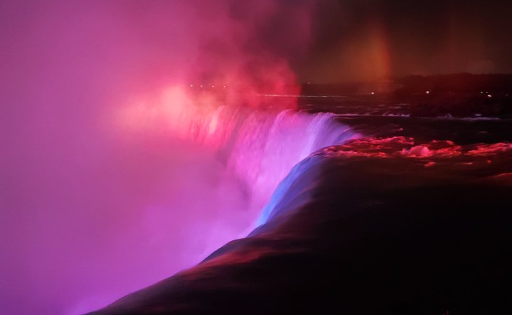 Niagara Falls lit in colors at night