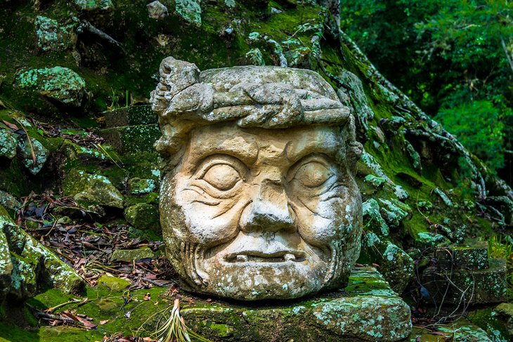 Carved old man head in the Copan Archaeological Site