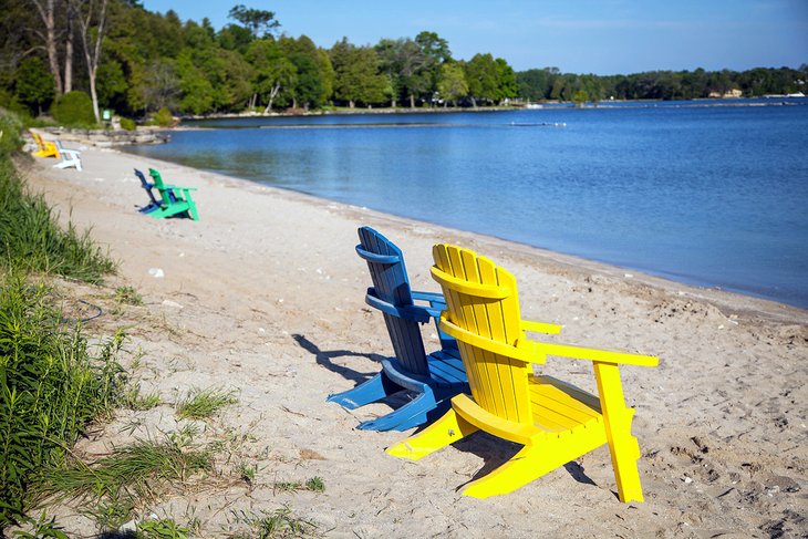 Adirondack chairs on a beach in Door County