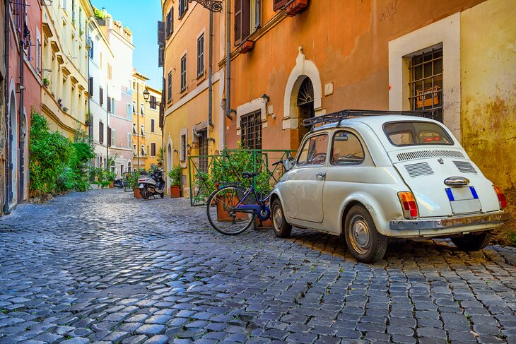 Car parked on a street in the Trastevere neighborhood of Rome