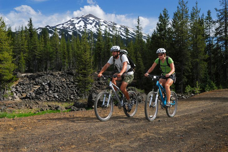 Mountain bikers in Bend with Mount Bachelor in the distance