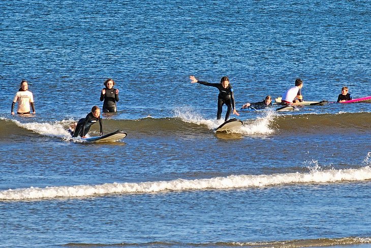 Learning to surf at Long Sands Beach
