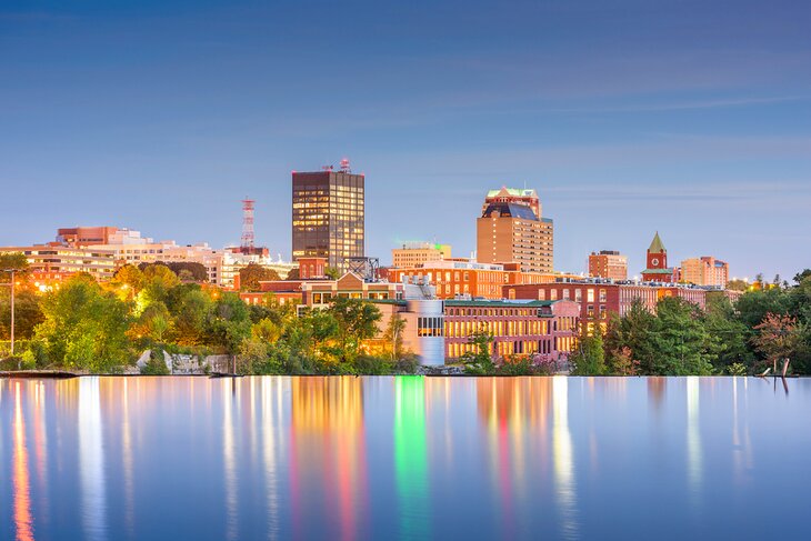 Manchester, New Hampshire skyline on the Merrimack River at dusk