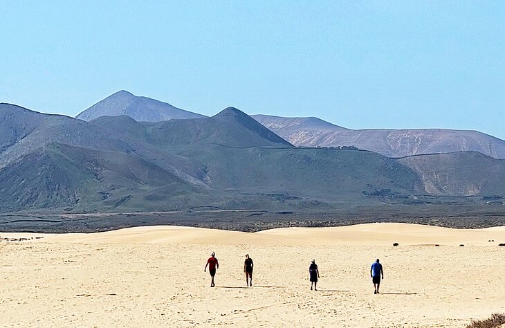 People walking in the dunes at Parque Natural Corralejo