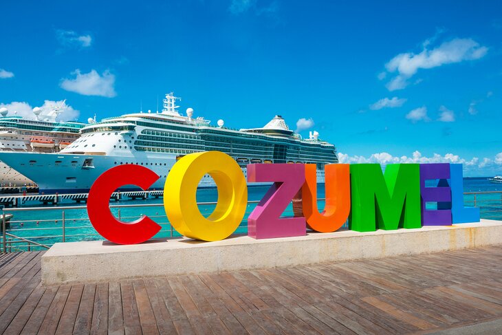 Cozumel sign and cruise ships