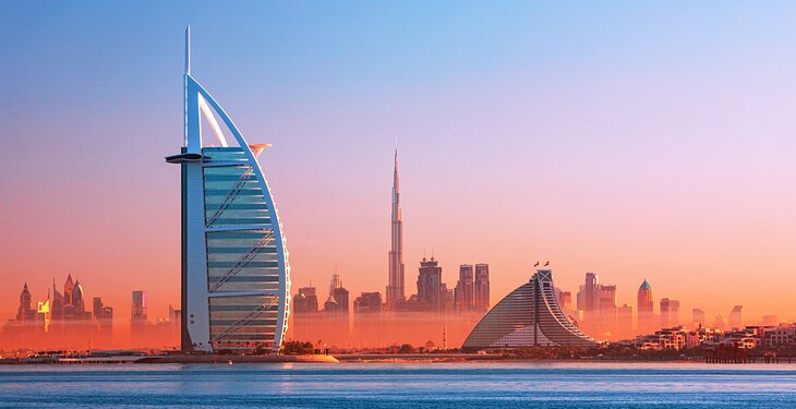 Burj Al-Arab and the Dubai skyline at sunset