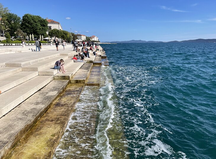 People enjoying the Sea Organ in Zadar