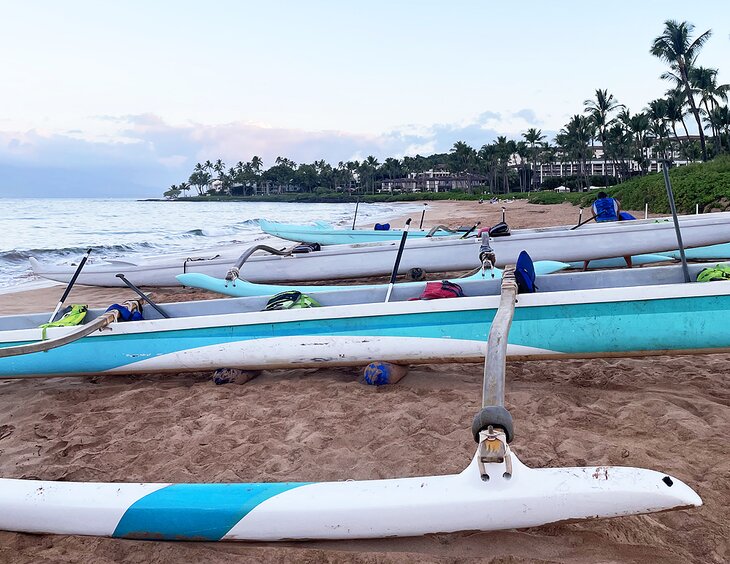 Outrigger canoes on the beach in the early morning