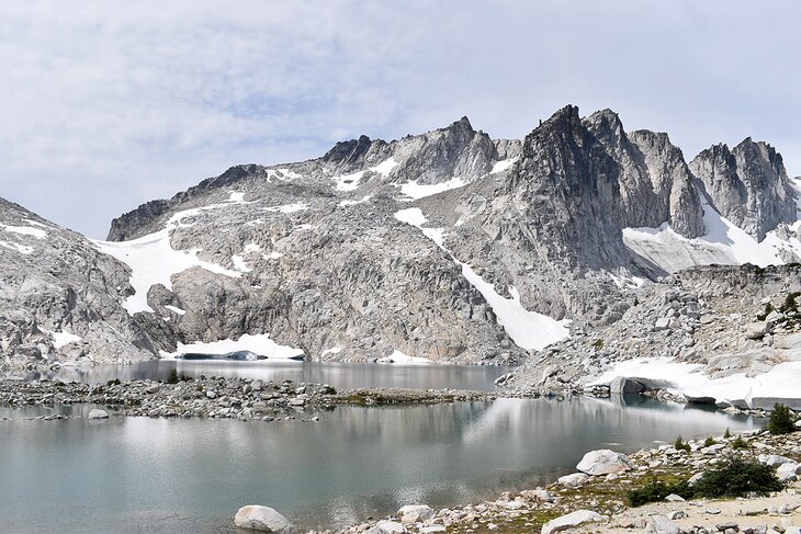 Snow along a lakeshore in the Enchantments