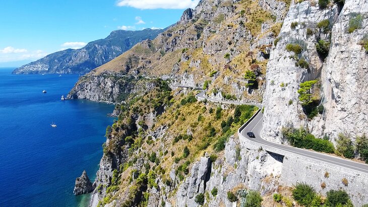 A car driving along the Amalfi Coast