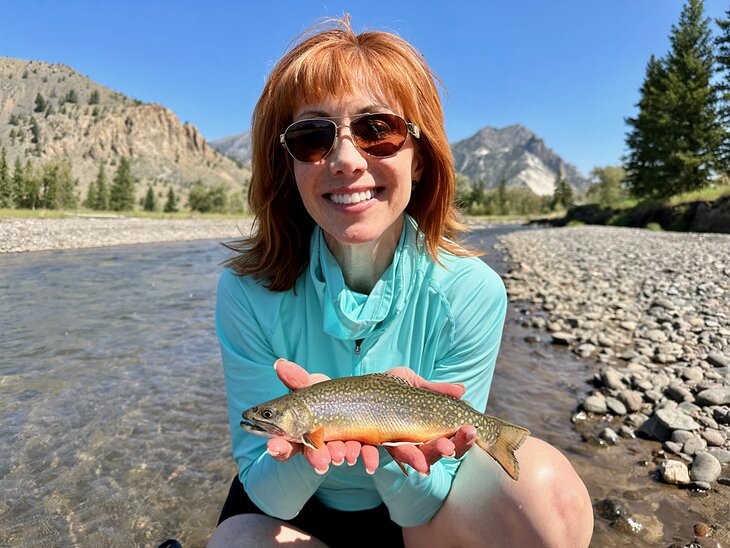 Author Anietra Hamper with a brook trout on Sunlight Creek: