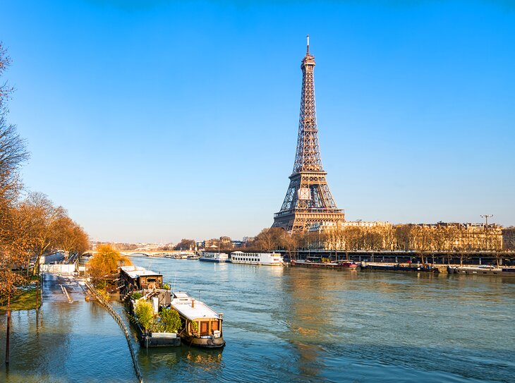 Cruise boats in front of the Eiffel Tower in winter 