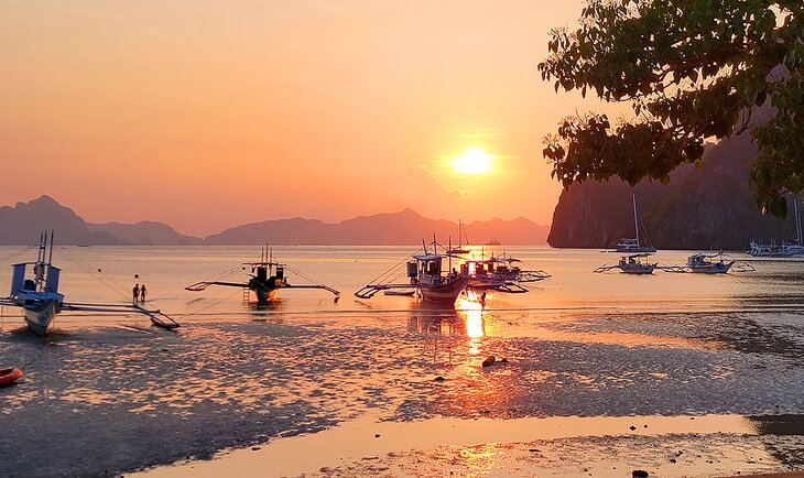 Traditional boats and sunset on Palawan Island