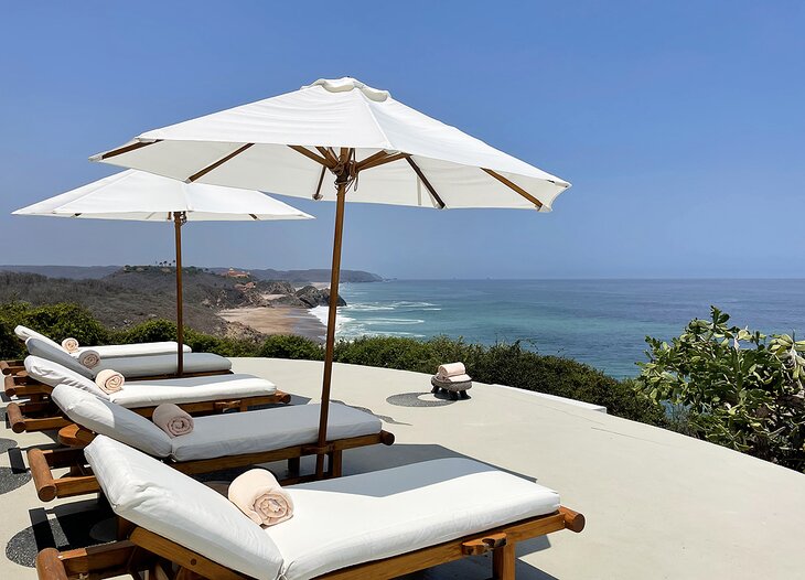 Sunbeds at El Cayeres overlooking the ocean on the Costalegre