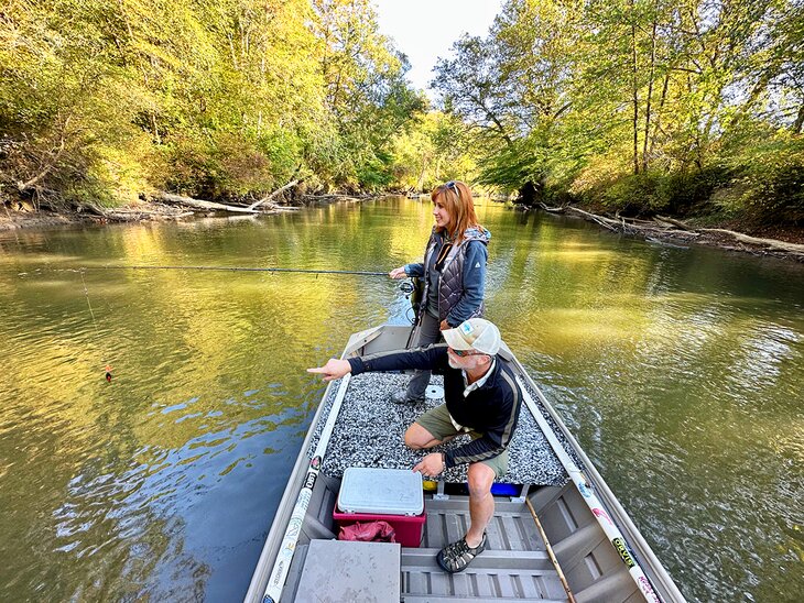 Author Anietra Hamper fishing on the French Broad River