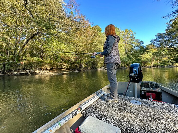 Author Anietra Hamper fishing on the French Broad River