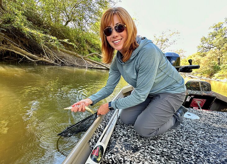 Author Anietra Hamper stocking muskie in the French Broad River