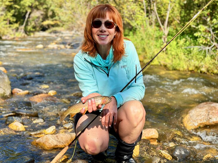 Author Anietra Hamper with a cutthroat trout on the Upper Clarks Fork