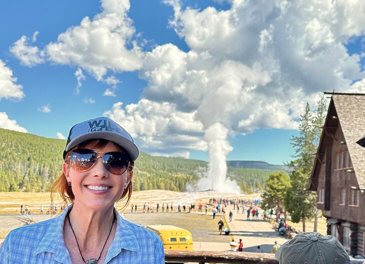 Author Anietra Hamper in front of Old Faithful