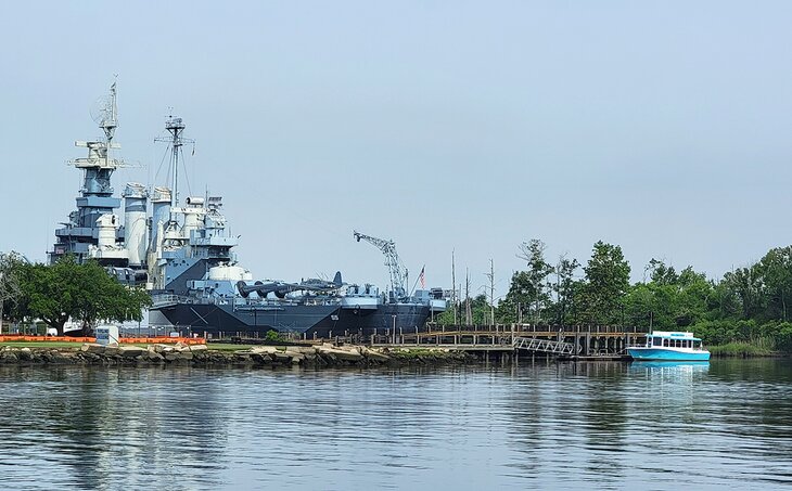 View of Battleship North Carolina and a water taxi, seen from the Riverwalk